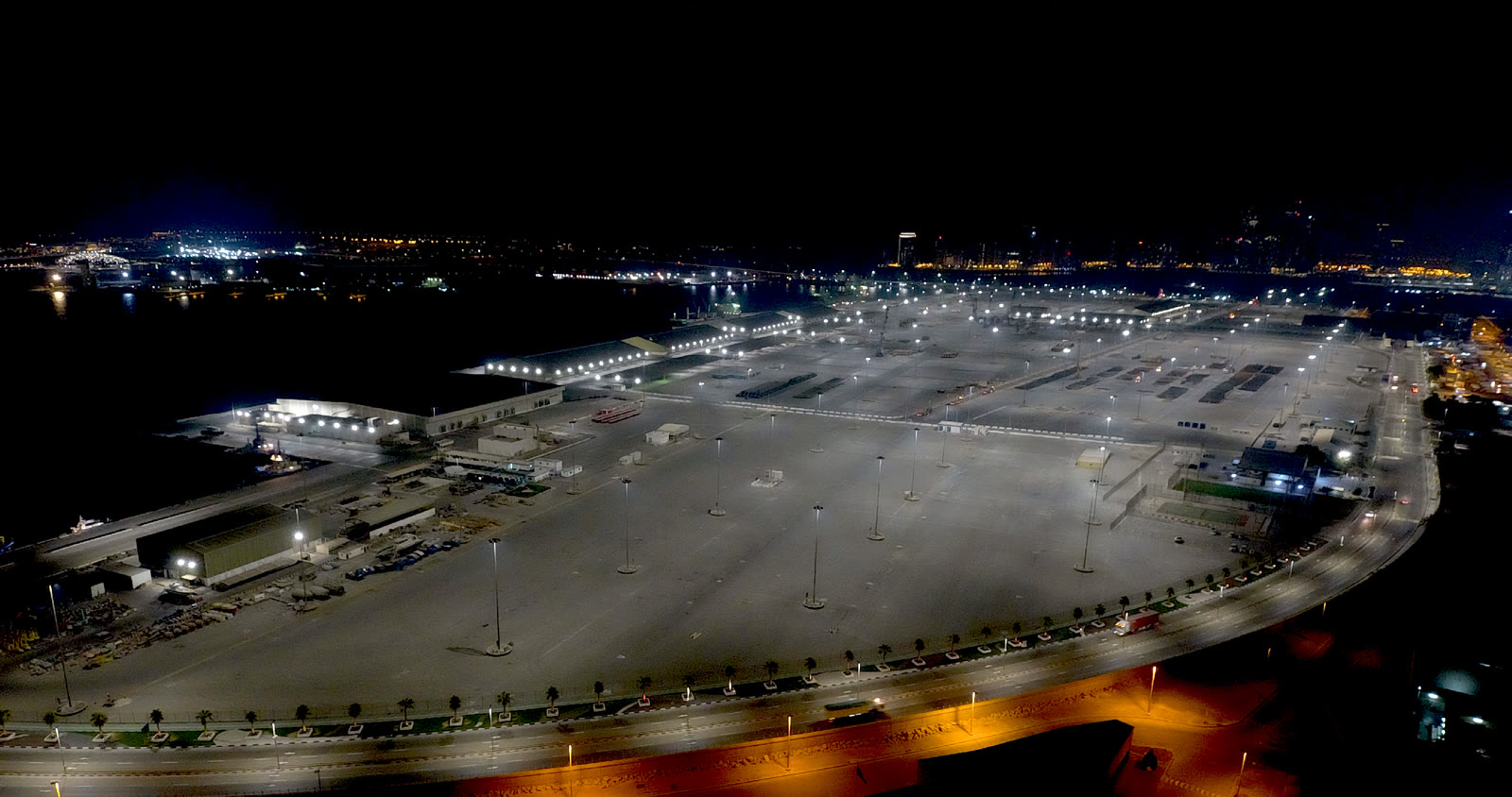 Mina Zayed Port after R9 conversion — bright, uniform white light across the yard