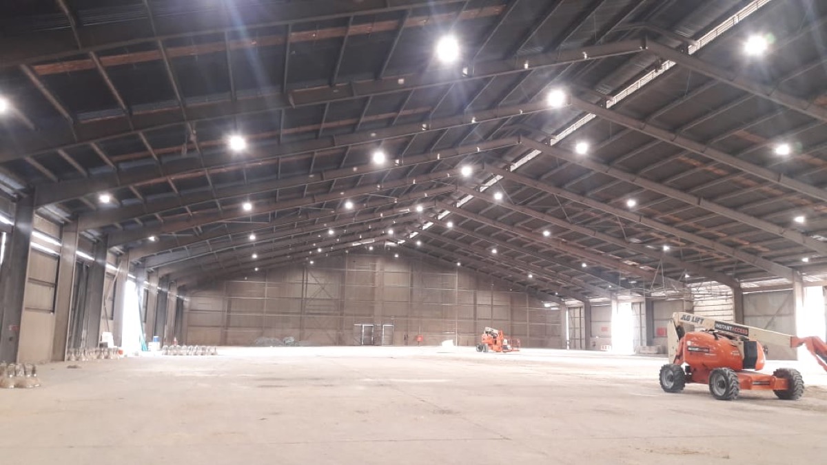 High-bay LED lighting installed inside a Mina Zayed warehouse