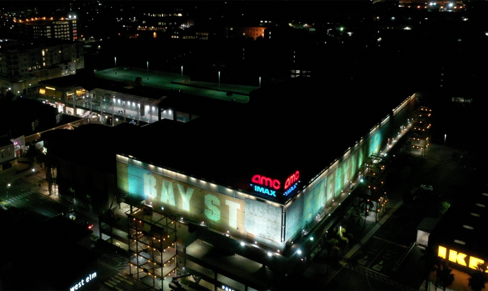 Bay Street aerial before — dim, patchy façade floodlighting