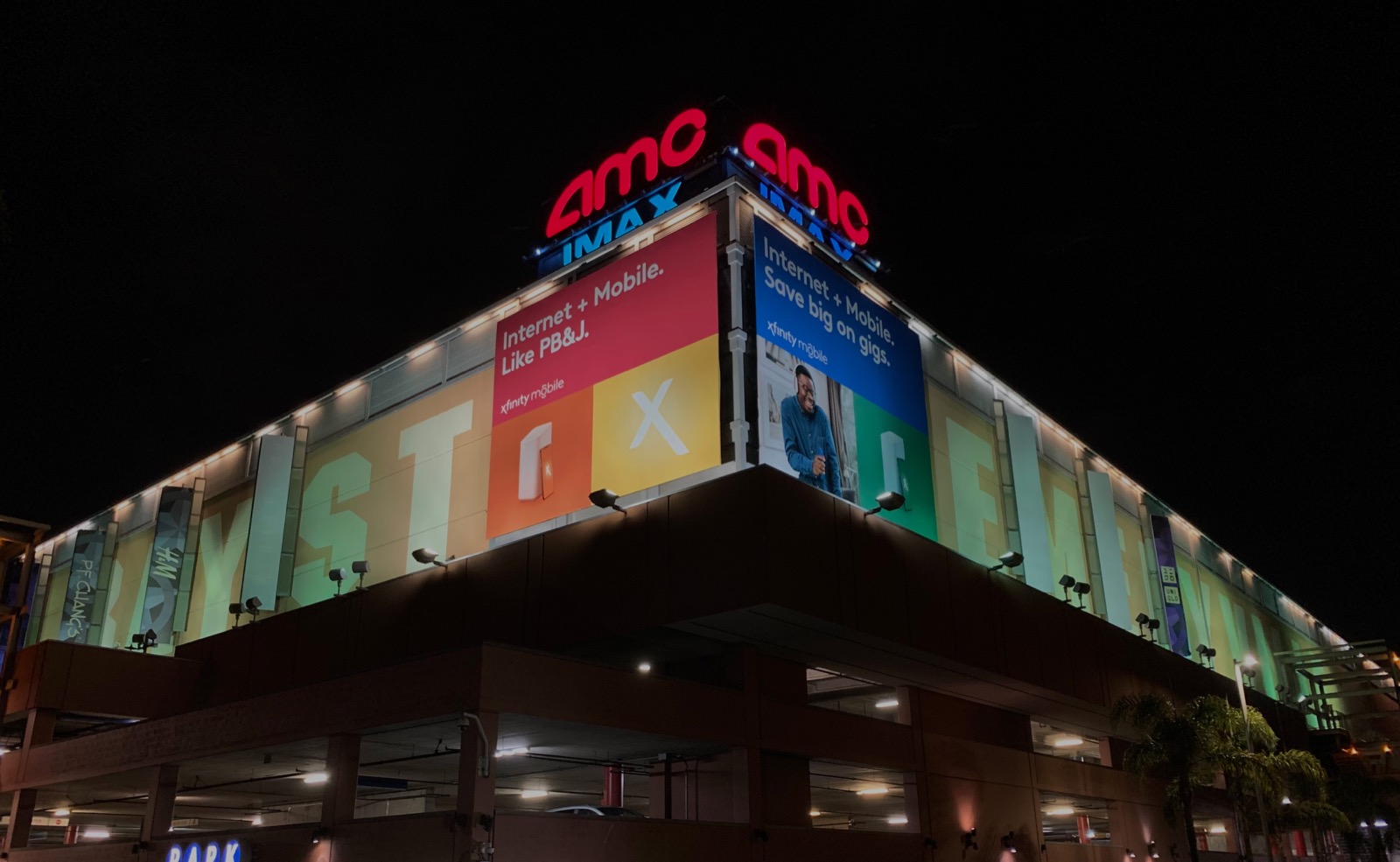 Bay Street AMC before — static warm floodlighting