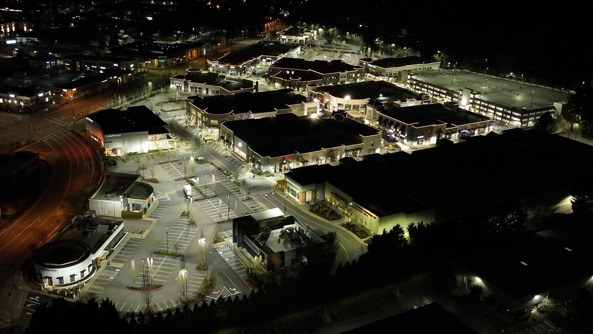 Aerial of Bridgeport Village at night — parking fields evenly lit by R9 fixtures