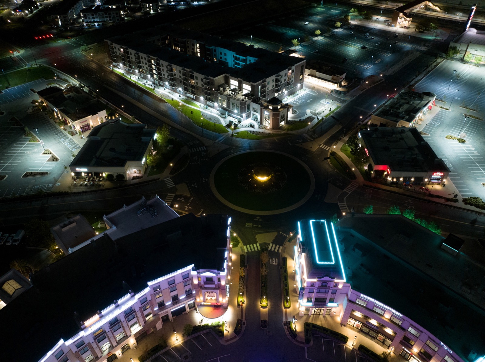 Roundabout district at night before retrofit — dark streets and crosswalks