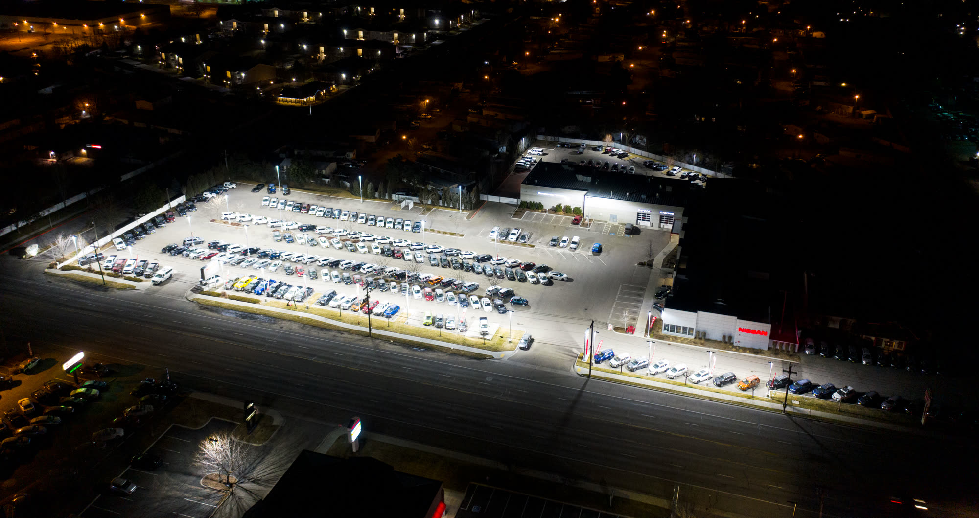 Drone photo of the finished site at night — matching the prediction