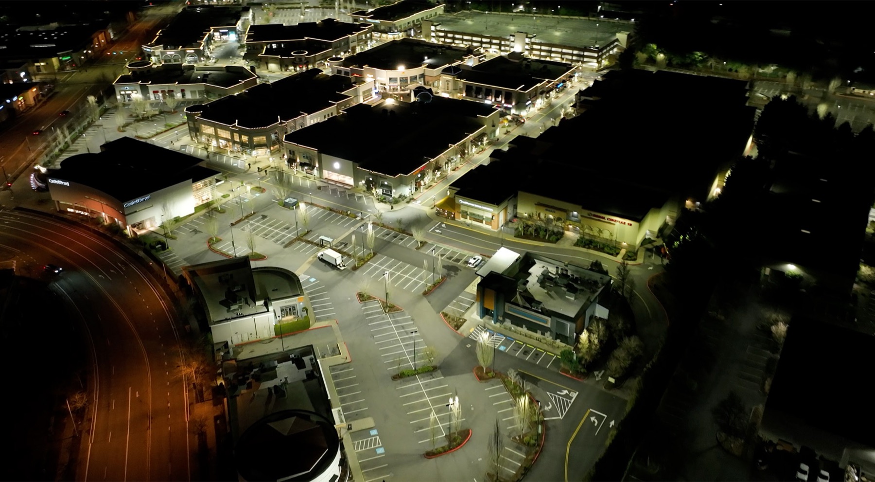 The same lot after the R9 redo — bright, even light across every stall and lane