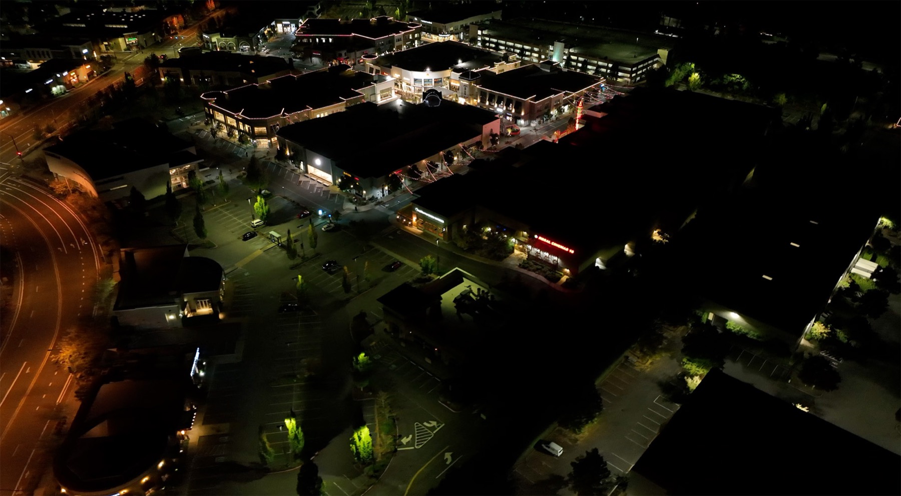 Bridgeport Village before R9 — a previous LED conversion left the lot patchy and dark